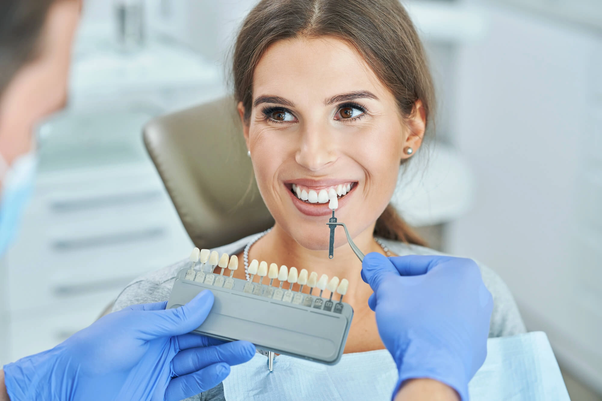 Dentist-discussing-teeth-shades-before-Teeth-whitening-Clawson
