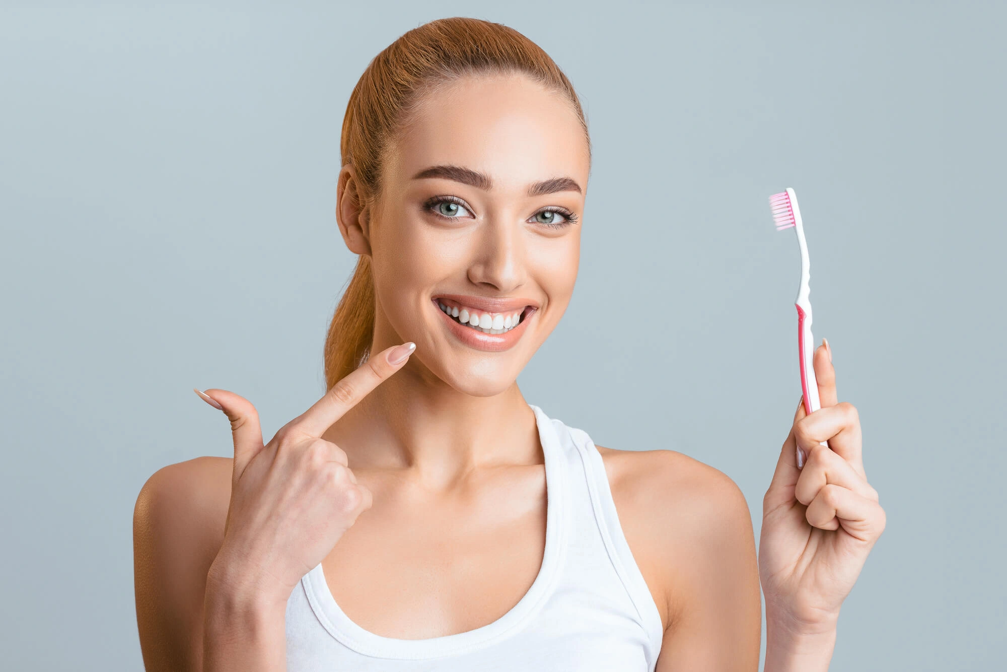 Girl-brushing-teeth-after-Periodontics-Clawson