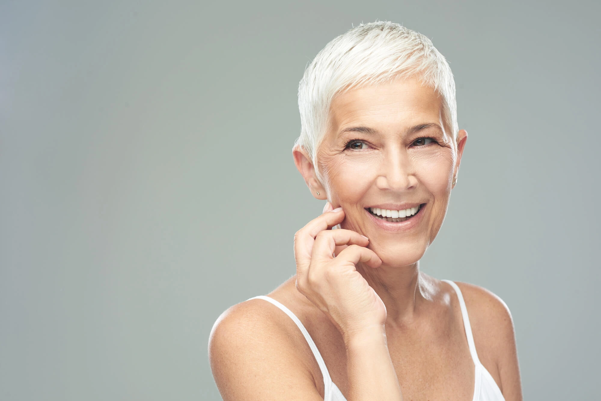 Woman-smiling-after-dental-cleaning-services